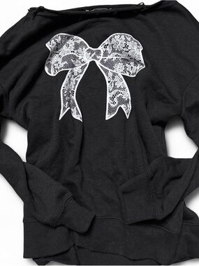Kohl's Black Off-the-Shoulder Sweater with White Lace Bow Graphic